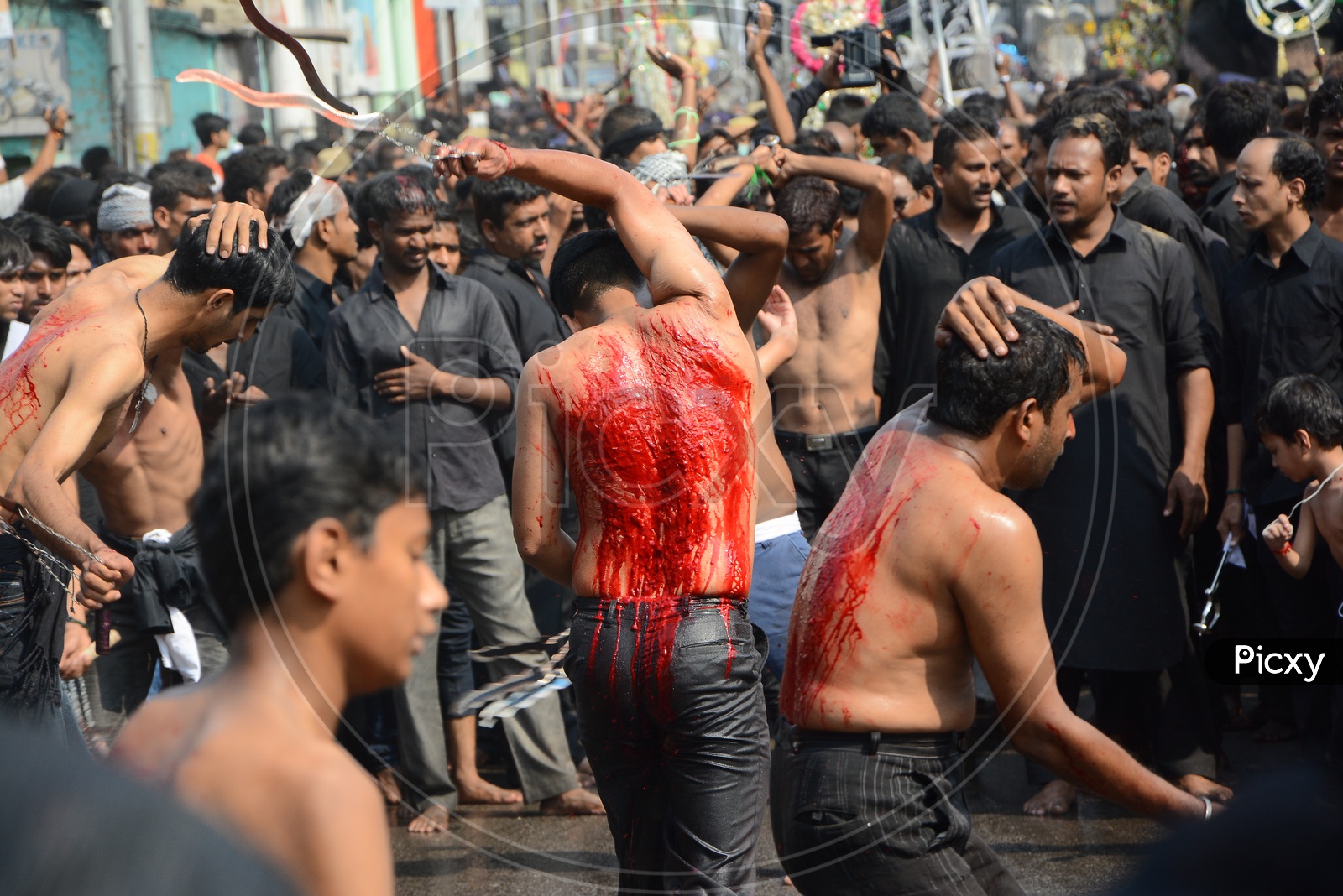 Muslims flagellate themselves in a procession to mark Ashoura during Muharram