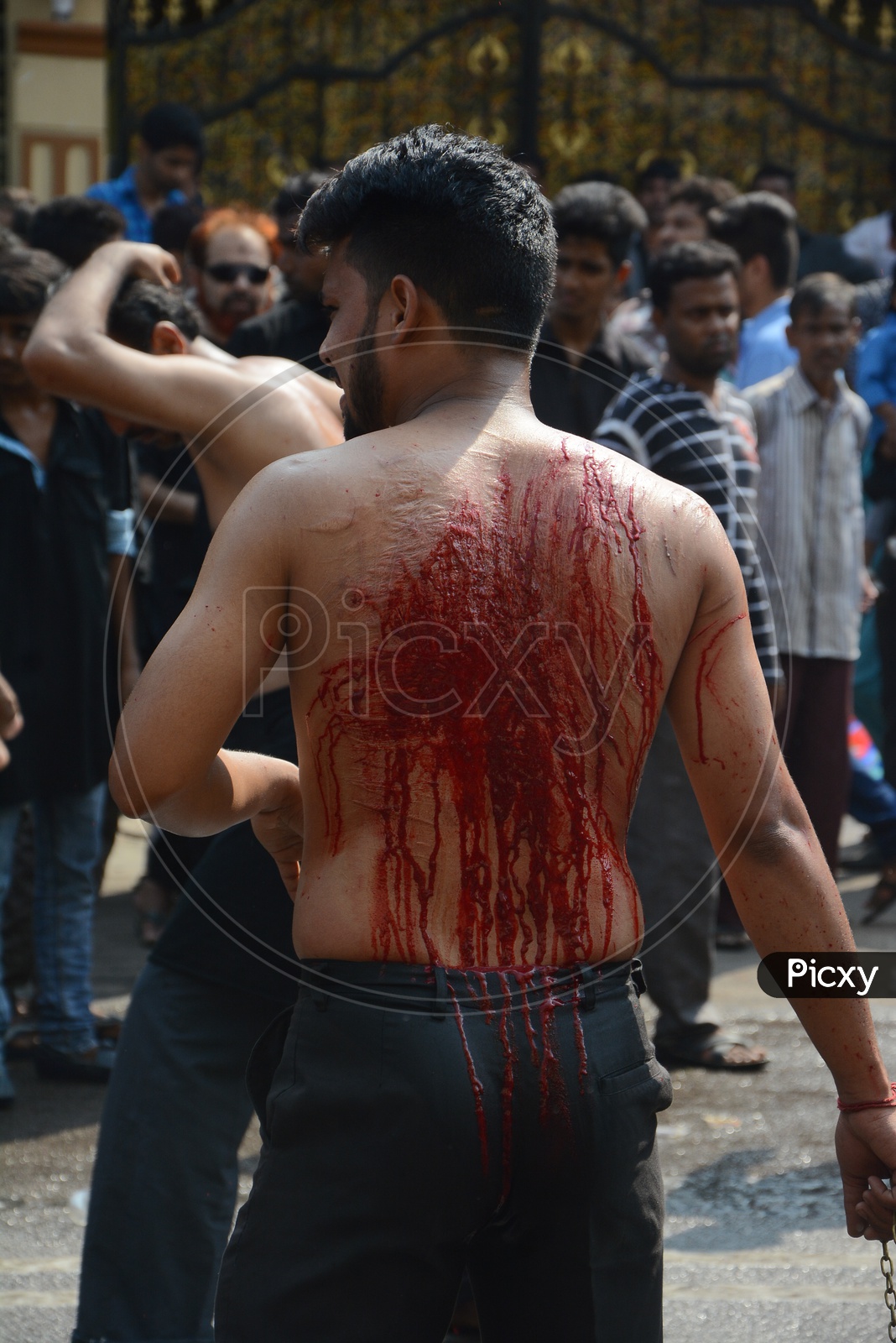 Muslims flagellate themselves in a procession to mark Ashoura during Muharram