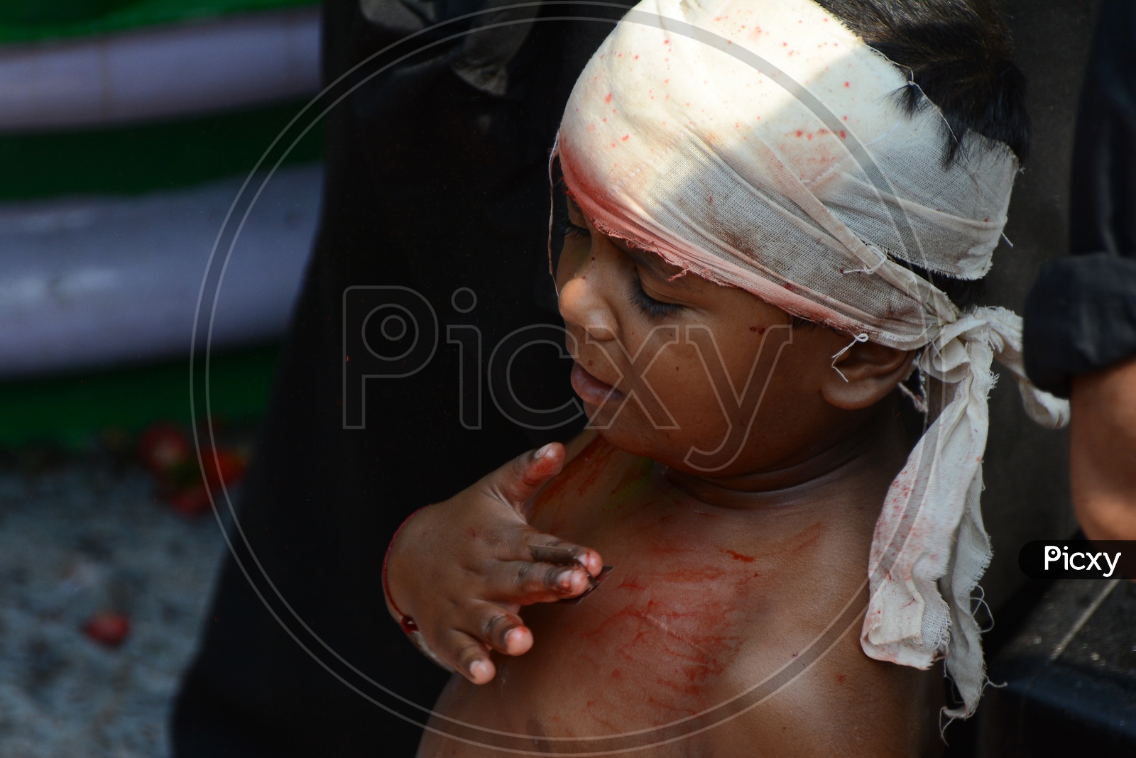 Muslim Child flagellate himself in a procession to mark Ashoura during Muharram