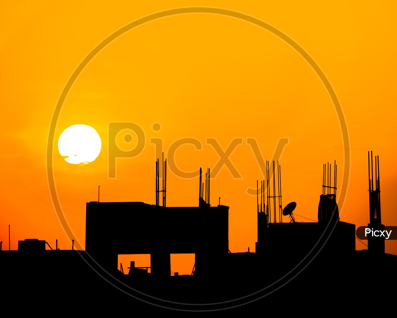 construction site silhouette with dish antenna