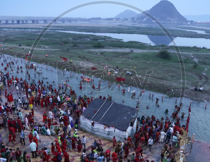 Pilgrims Bathing in the Holy River of Krishna at Krishnaveni Ghat on 9th day of Durga Navrathri's uring Dasara/Dussehra