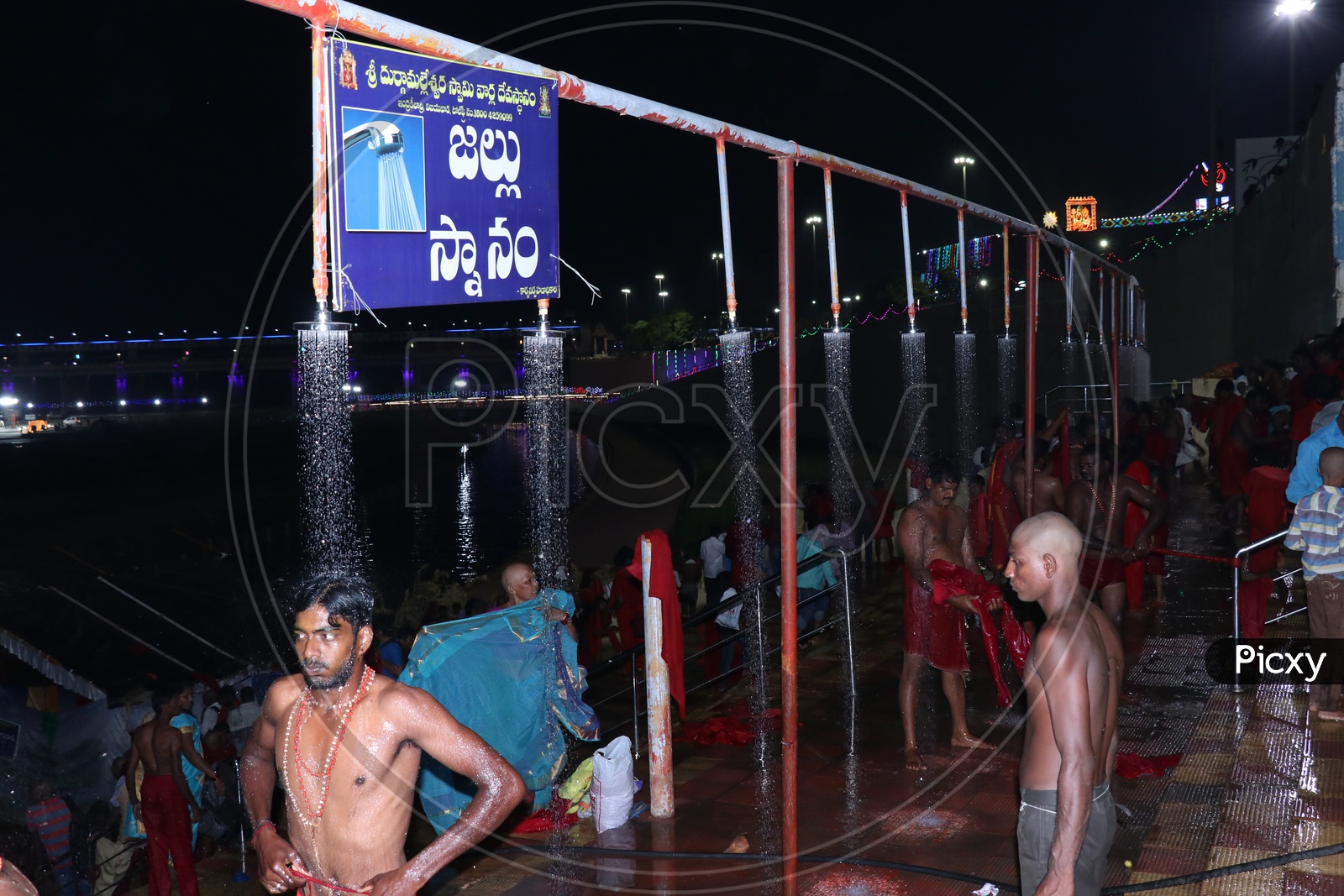 Pilgrims bathing at Krishnaveni ghat on 9th day of Durga Navrathri's uring Dasara/Dussehra