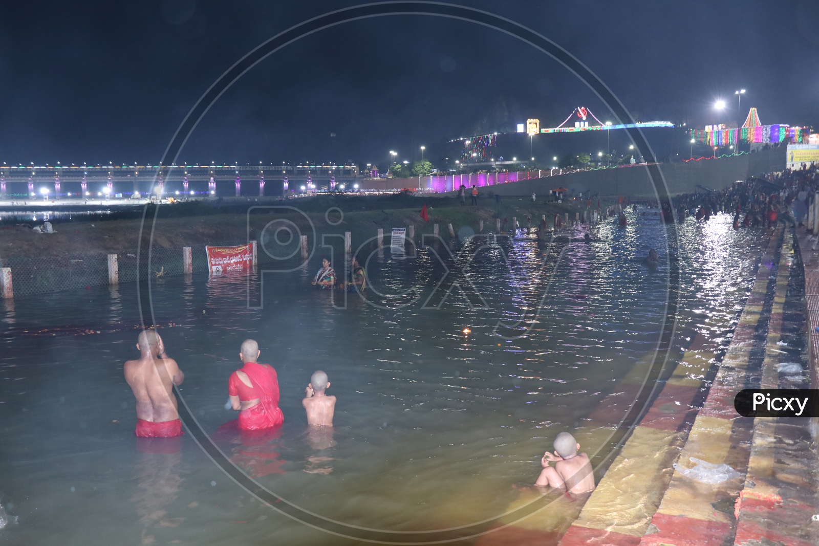 pilgrims/Devotees bathing on 9th day of Durga Navrathri's uring Dasara/Dussehra