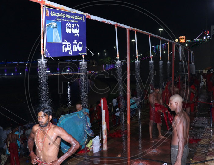 Pilgrims bathing at Krishnaveni ghat on 9th day of Durga Navrathri's uring Dasara/Dussehra