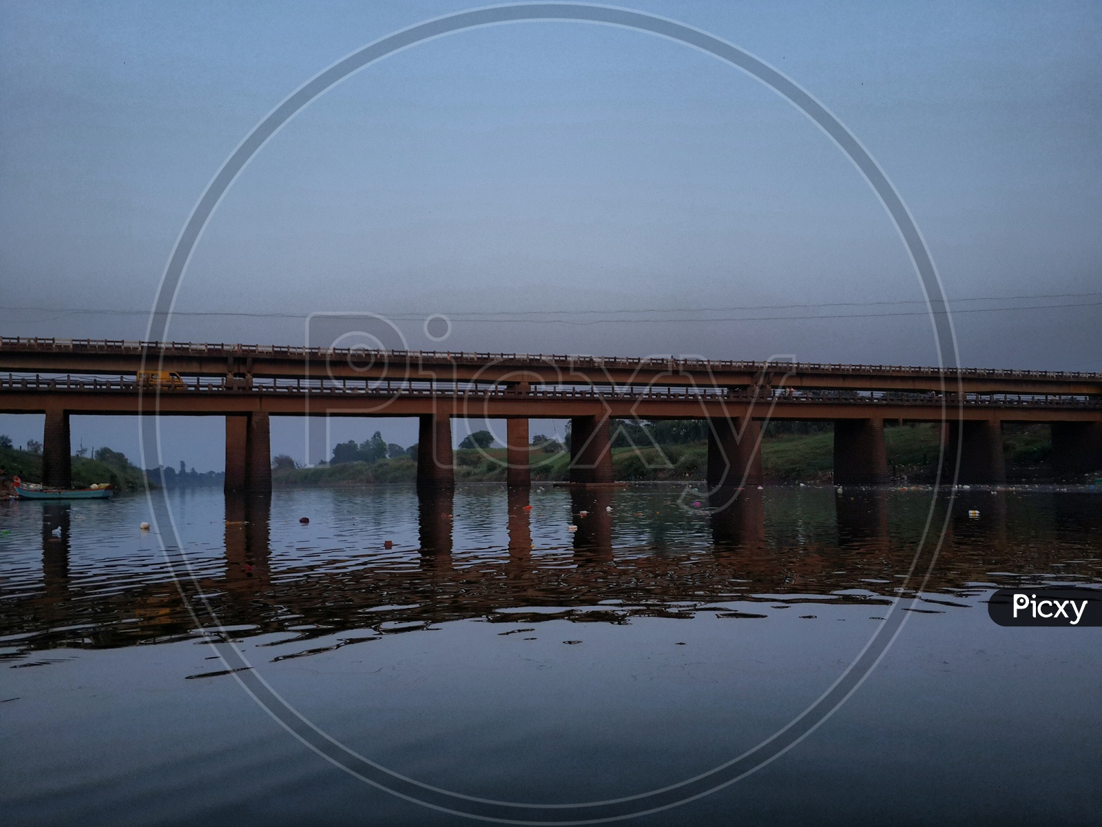 Old bridge over panchaganga river and water reflection