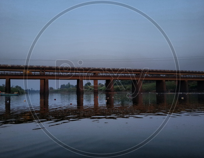 Old bridge over panchaganga river and water reflection