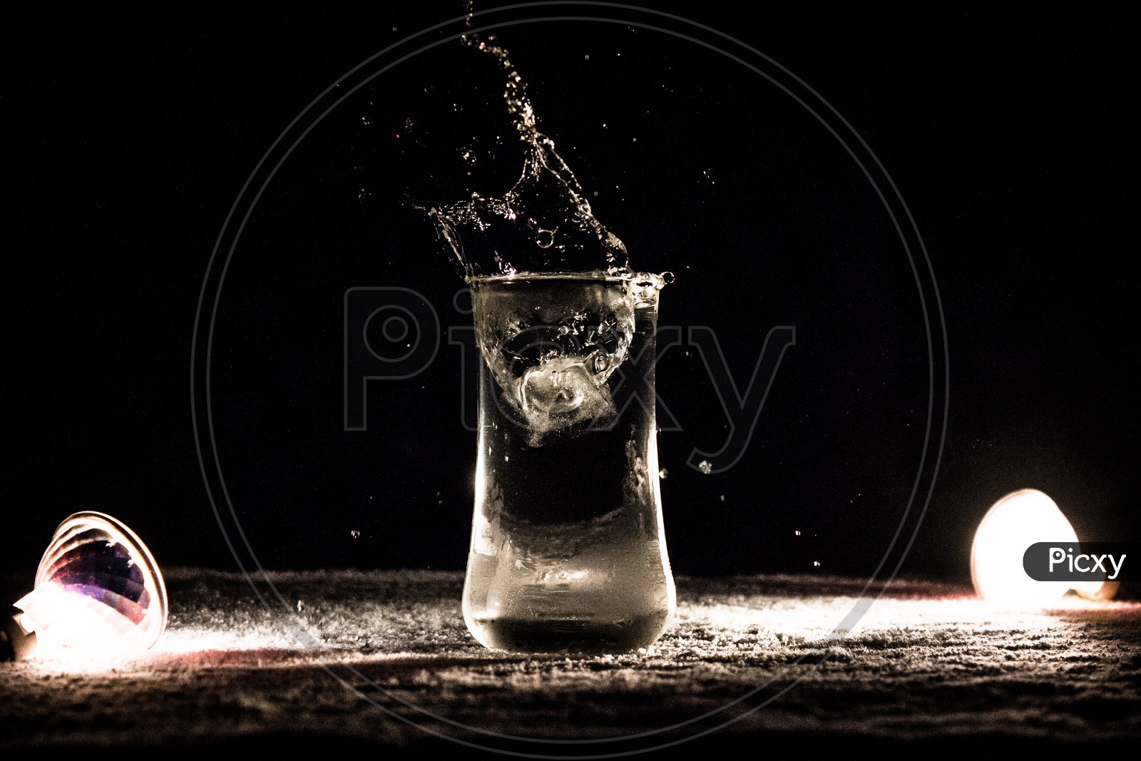 Stone Drop into  Water Glass