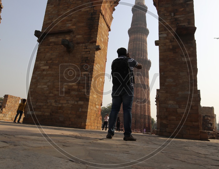 Photographer Capturing Picture of Qutb Minar