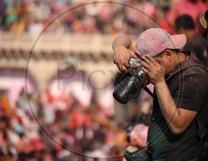 Photographer Capturing Holi Festival in Nandgaon