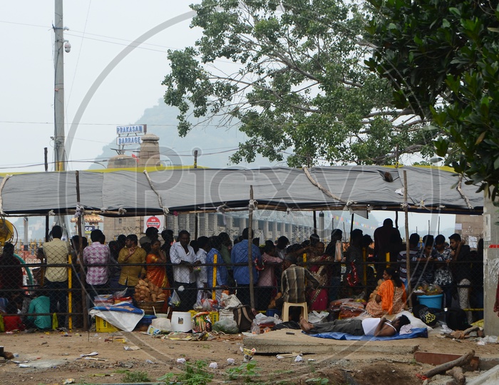Hindu devotees wait in the queue line for darshan of Goddess Kanaka Durga.