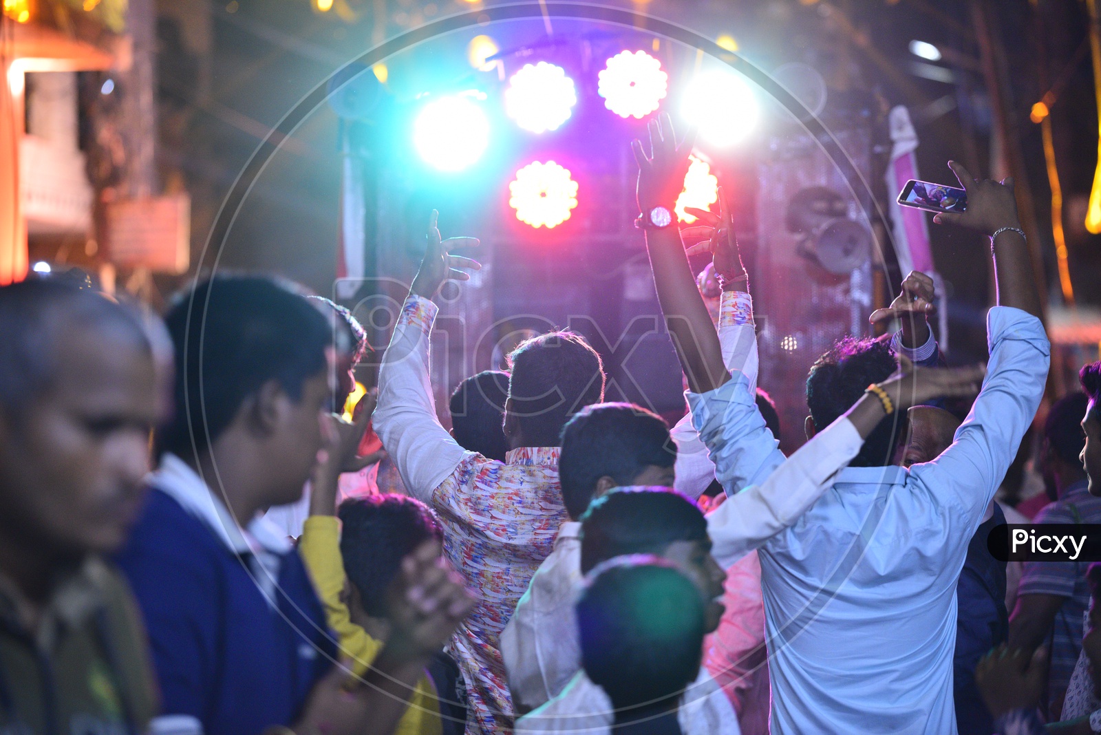 People dance at a gathering