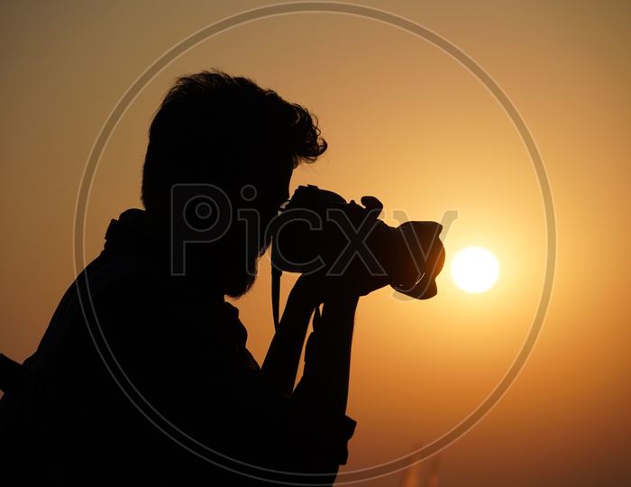 Photographer Capturing Sunset