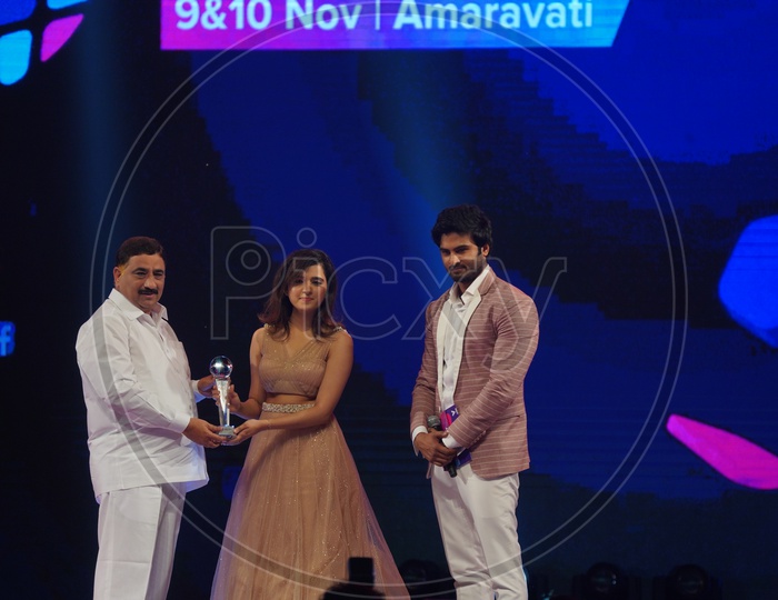 AP Housing Minister Kalava Srinivasulu and Sudheer Babu giving 'Music Sensation On Social Media' Award to Shirley Setia in Social Media Summit & Awards Amaravati 2018