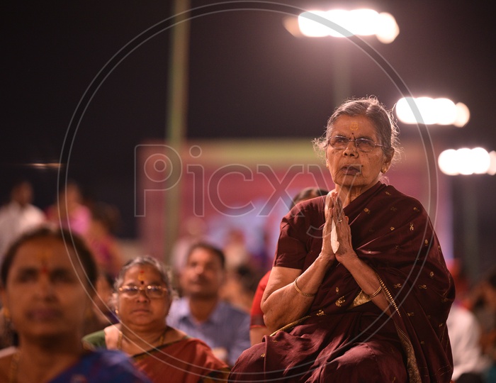 an elder woman devotee at Koti deepotsavam