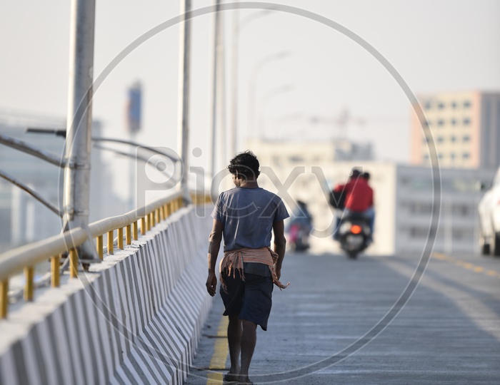 a man walks on the new flyover at Mindspace Junction