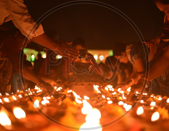 Indian Hindu women light up Diyas at Koti Deepotsavam, 2018