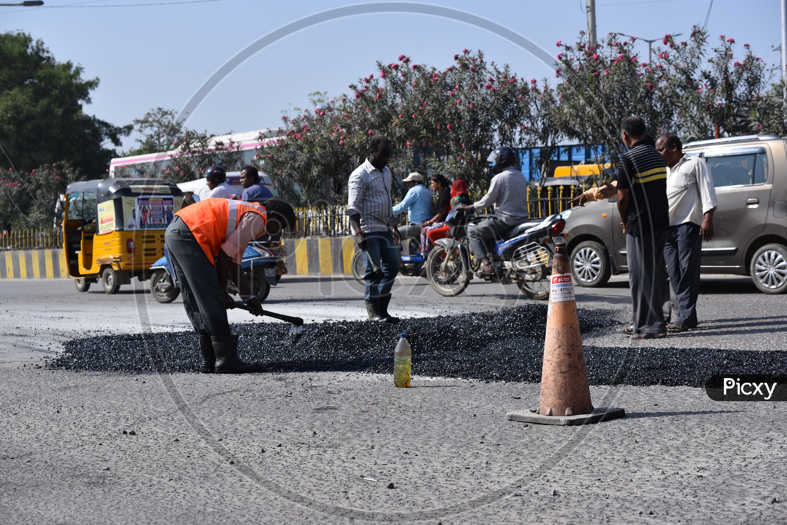Road repair works by GHMC