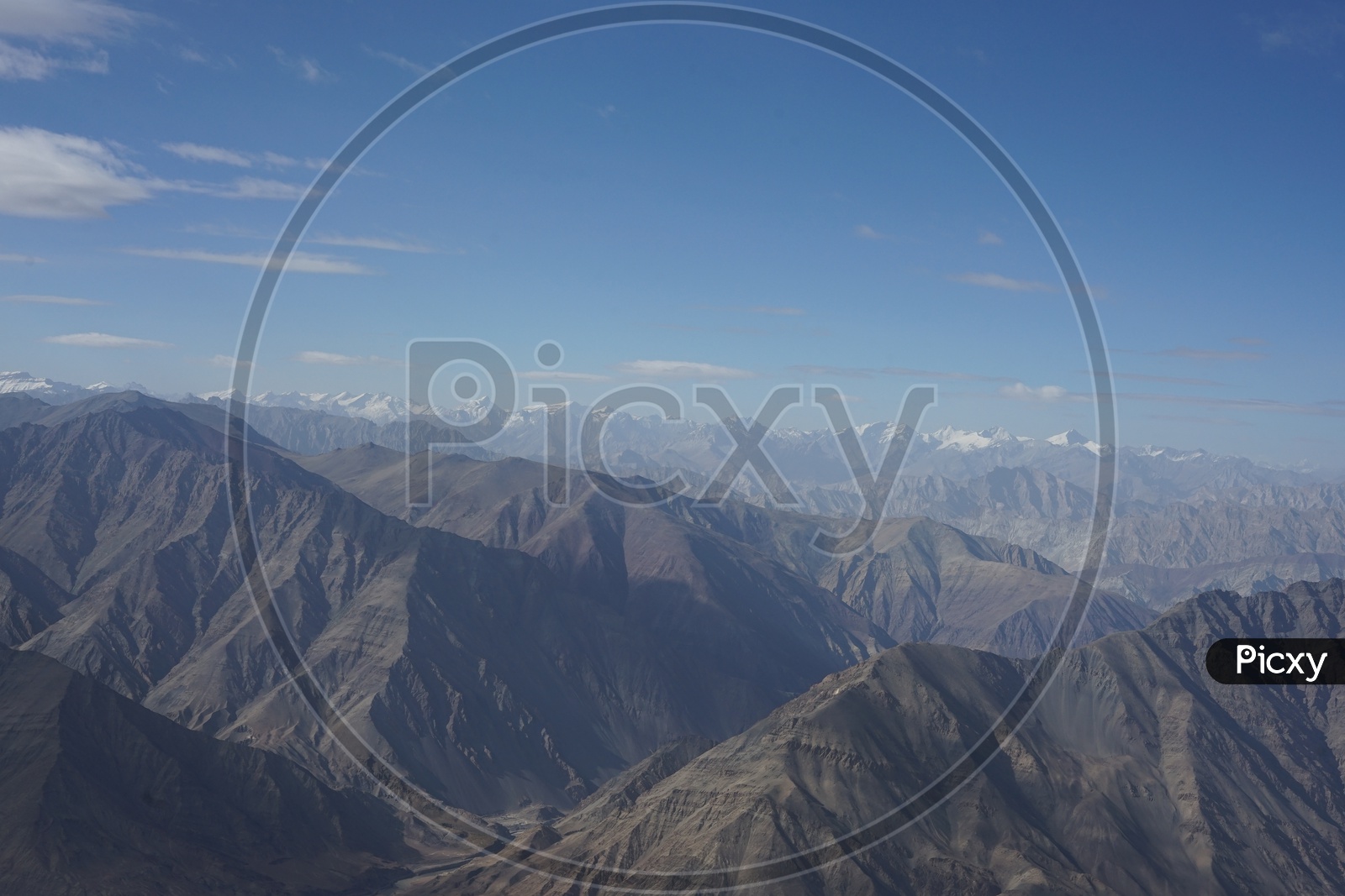 Beautiful Landscape of Himalayan mountains captured from aircraft /  Himalayas / Snow Capped Mountains / Himalayas with Beautiful Clouds