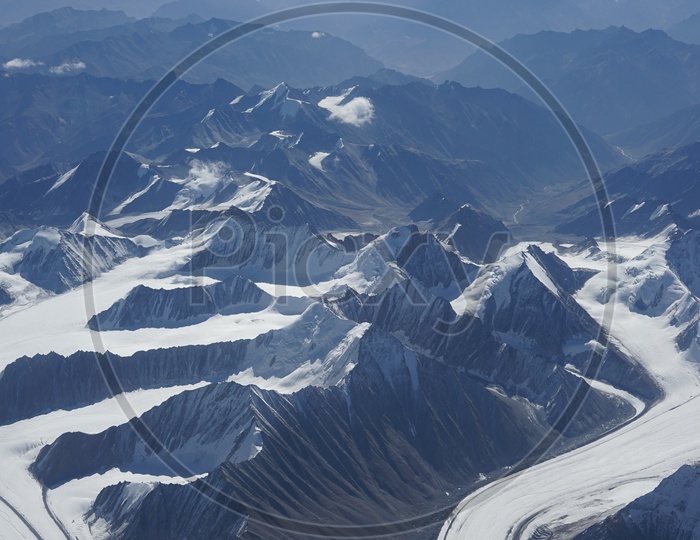 Beautiful Himalayan mountains captured from aircraft /  Himalayas in Aerial View / Snow Capped Mountains