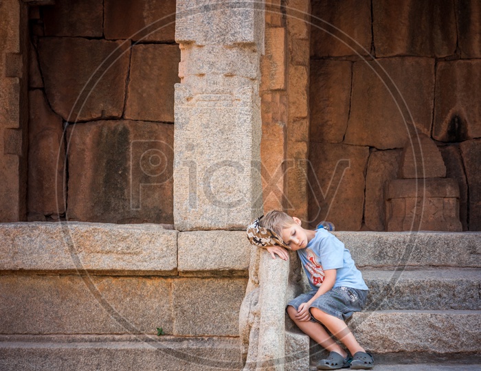 A Foreign Boy At Historic Hampi Temple