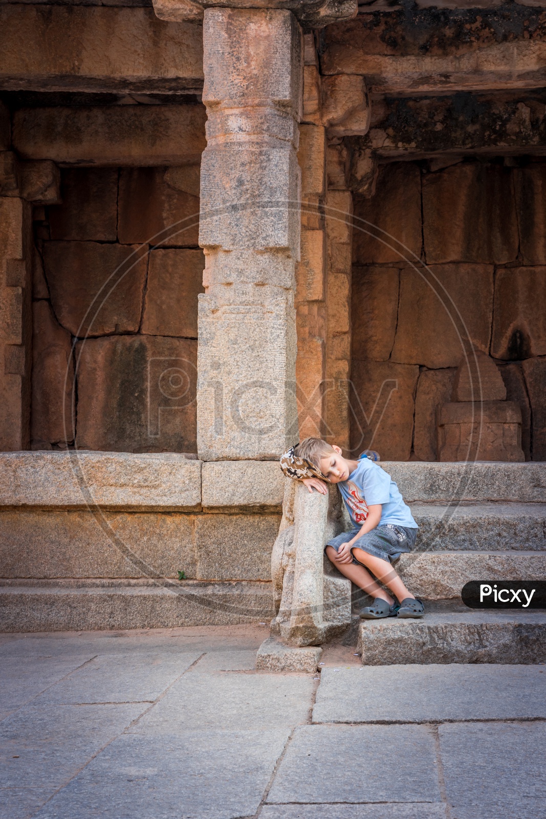 A Foreign Boy At Historic Hampi Temple