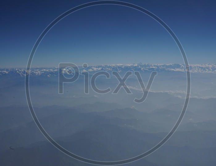 Himalayas snow capped mountains captured from aircraft