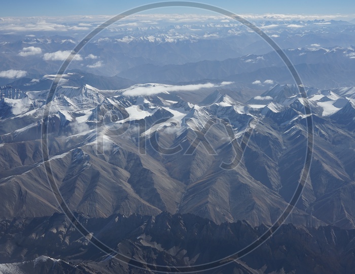 Beautiful Himalayan Snow capped mountains captured from aircraft/Himalayas Ranges in Aerial View