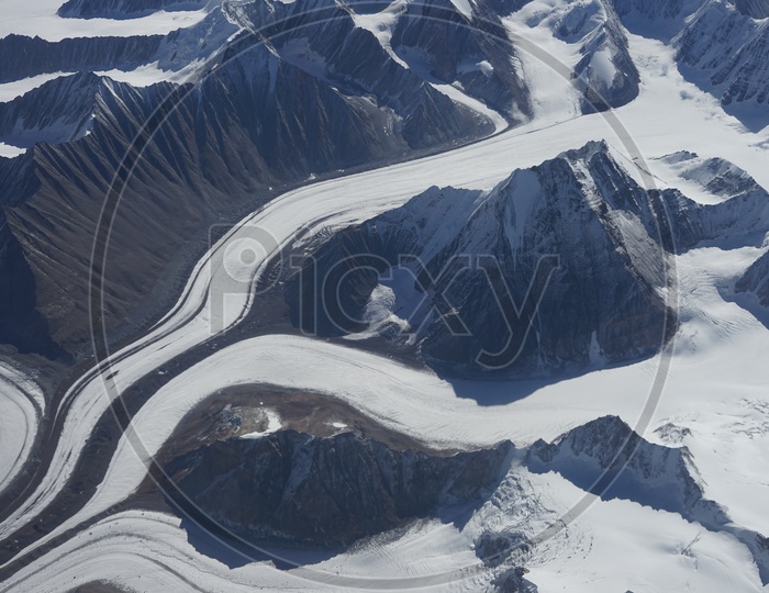 Beautiful Landscape of Himalayan mountains captured from aircraft /  Himalayas in Aerial View / Snow Capped Mountains