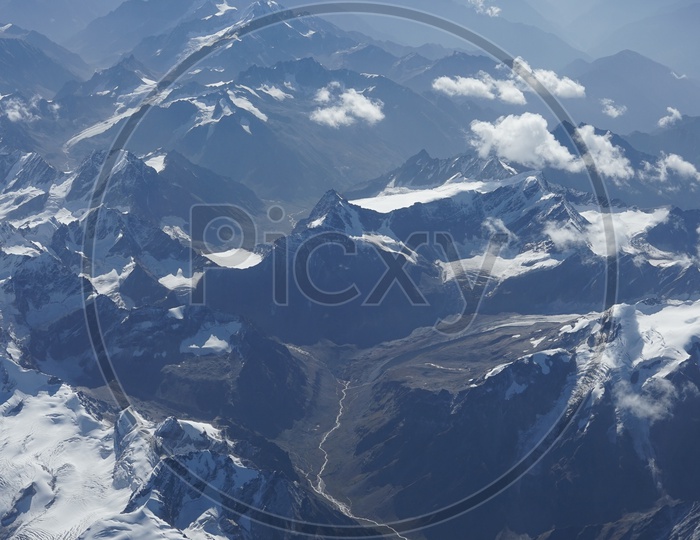 Beautiful Himalayan mountains captured from aircraft /  Himalayas in Aerial View / Snow Capped Mountains