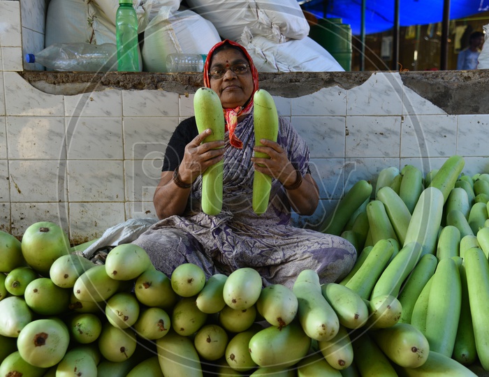 Bottle Gourd Seller at Local Vegetable Market/Rythu Bazar