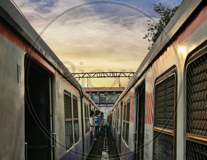 Mumbai local trains and a sunset