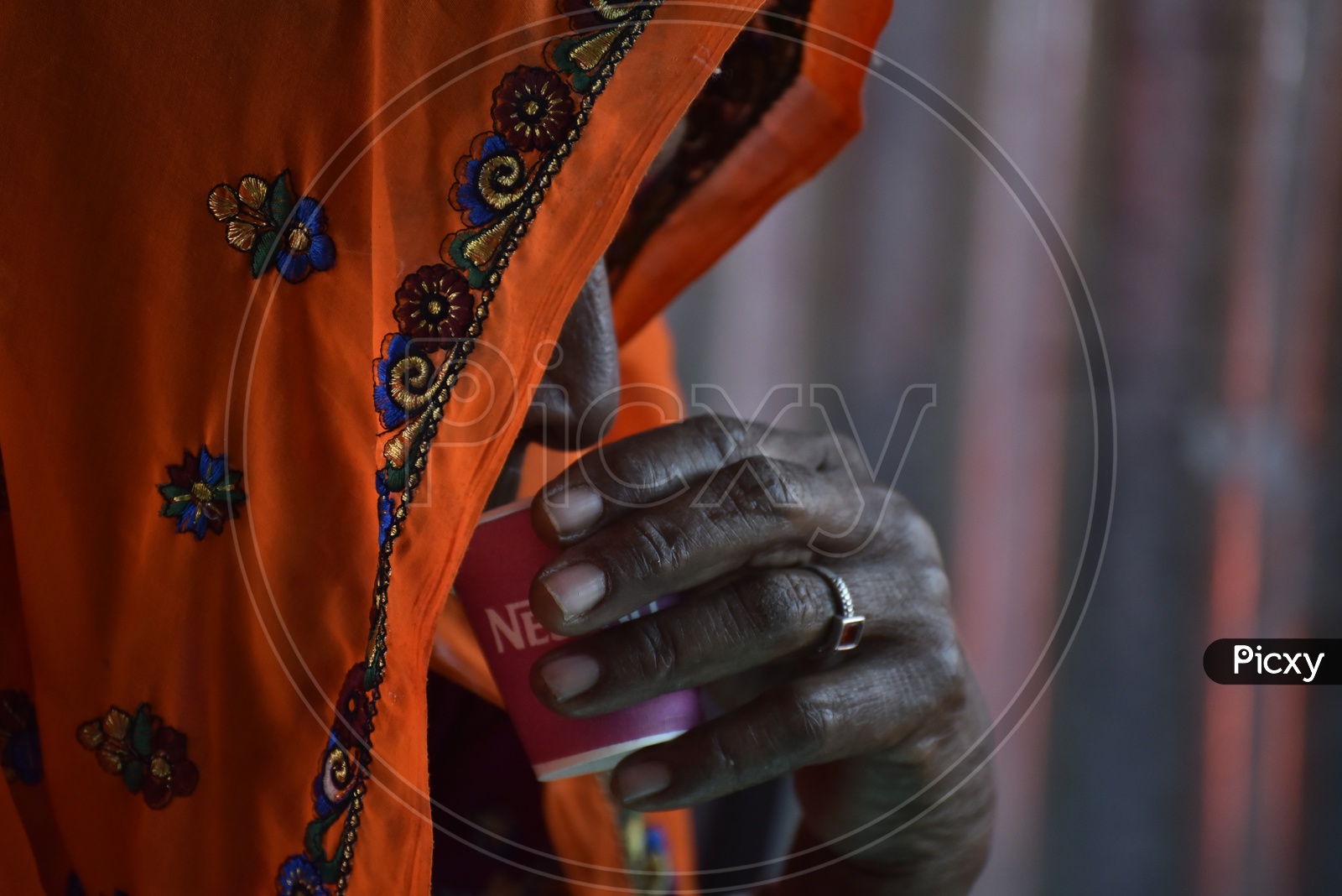 Rajasthani Woman in Traditional Attire Drinking Coffee at Pushkar Camel Fair