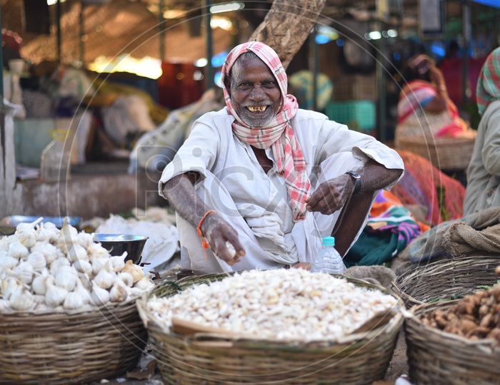 Garlic Seller at Local Vegetable Market/Rythu Bazar