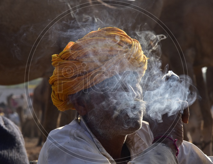 Rajasthani Man Smoking at Pushkar Camel Fair