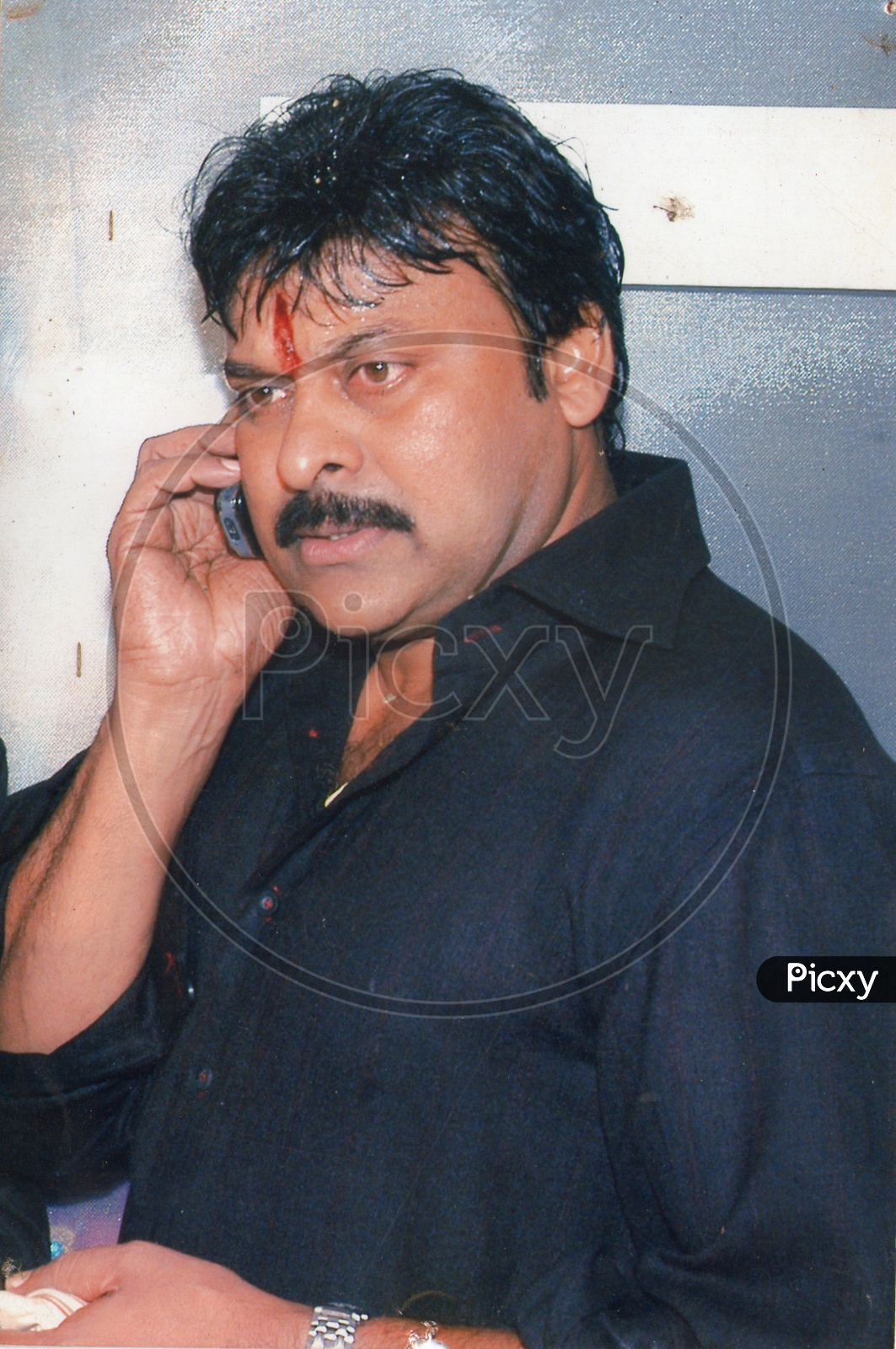 Actor Chiranjeevi using Mobile