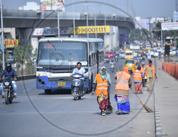 GHMC Workers Cleaning the Bharat Nagar Flyover on Morning Hours