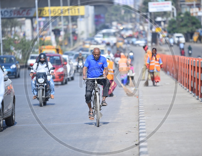 A cyclist Commuting on Bharath Nagar Flyover