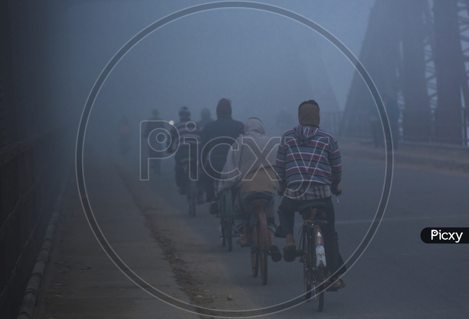 Foggy Mornings Of Varanasi  / Locals Commuting On Cycles As a part Of their Daily Life Routine in Varanasi India