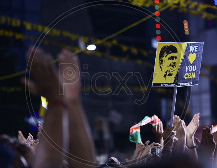 A group of Hyderabadi youth display placards written 'we love you CBN' during the Corner meeting at Satyam Theatre, Hyderabad.