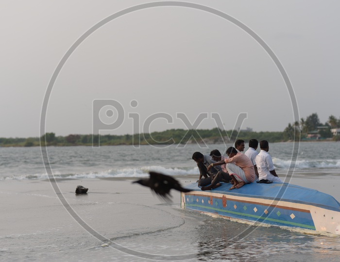 Men on Boat at Kochi Beach