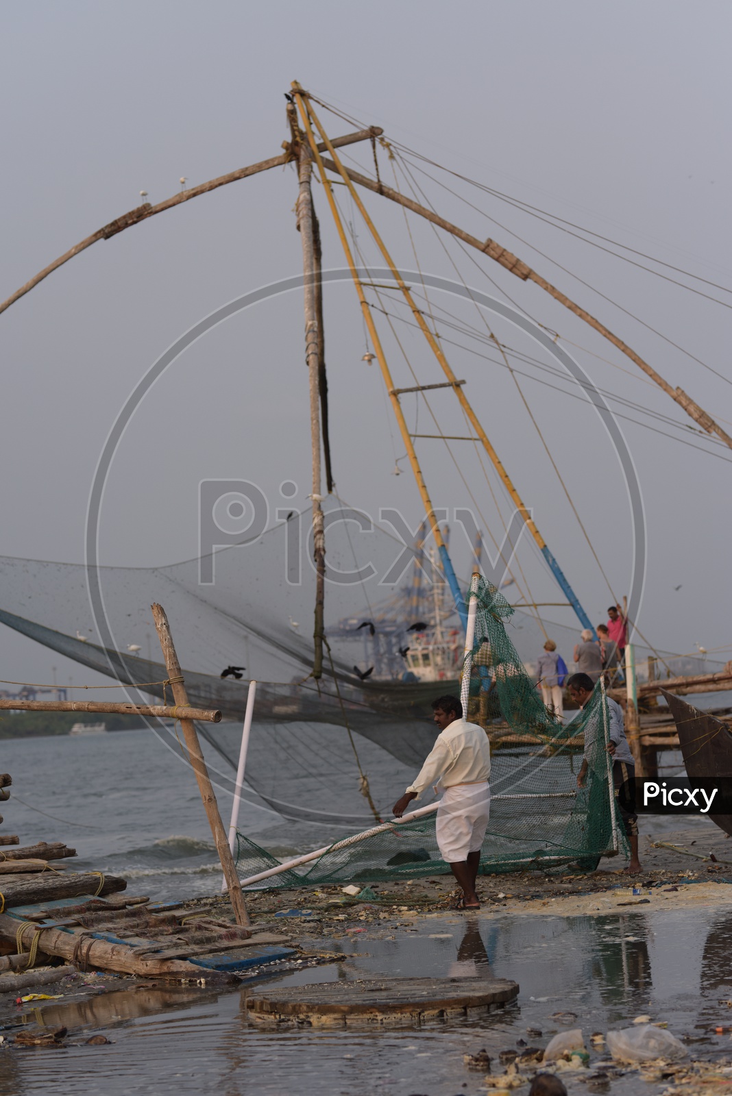 Fishermen at work - Kochi Beach