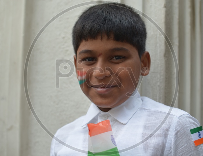 Indian Children Smiling FacesBoy Child Smiling Faces  / Indian Children Smiling Faces / Indian Boy Wearing National Flag on Independece day