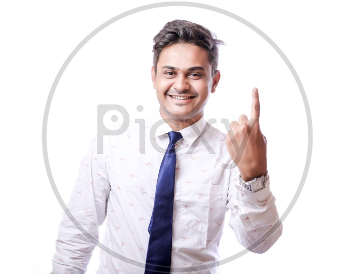 Portrait Of A Confident Youngman in Formalwear  With Expression and Showing to Space  With White  Background