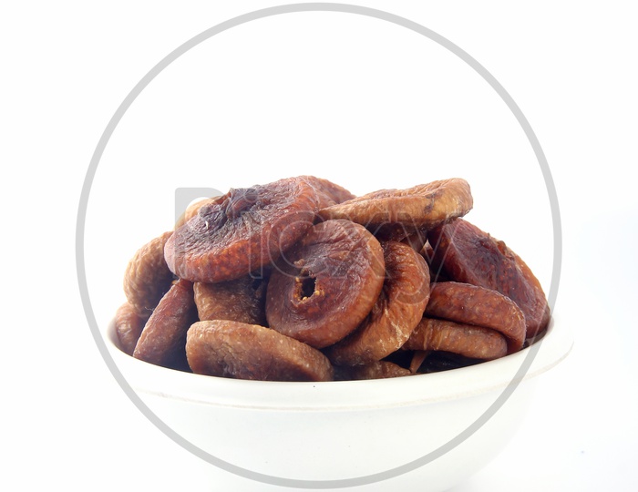 Dried Anjeera or Fig in a Bowl on an Isolated White Background