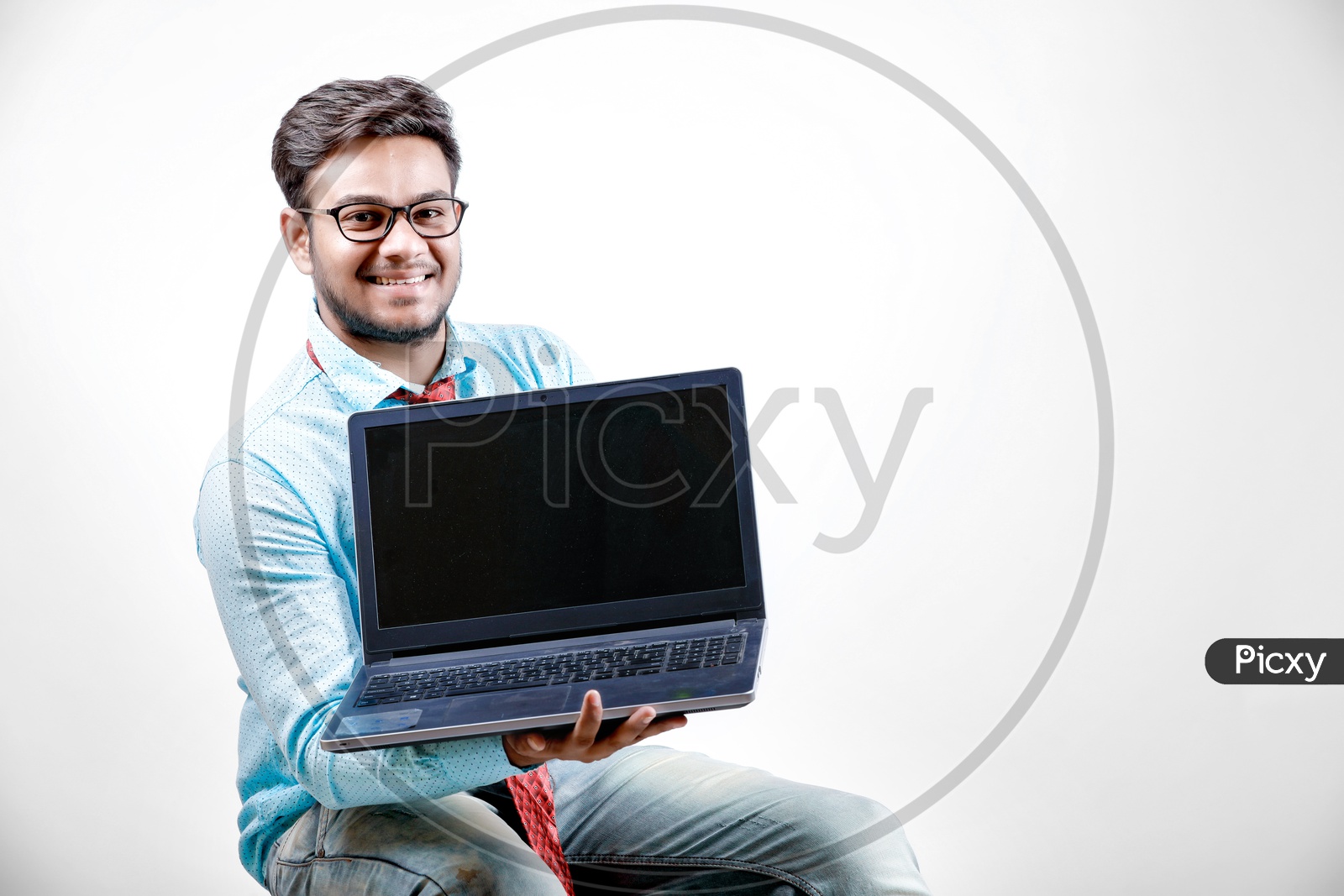 Young Indian Student/Businessman with Laptop