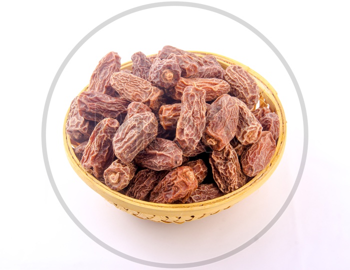 Dry Dates in Bowl Isolated in White Background