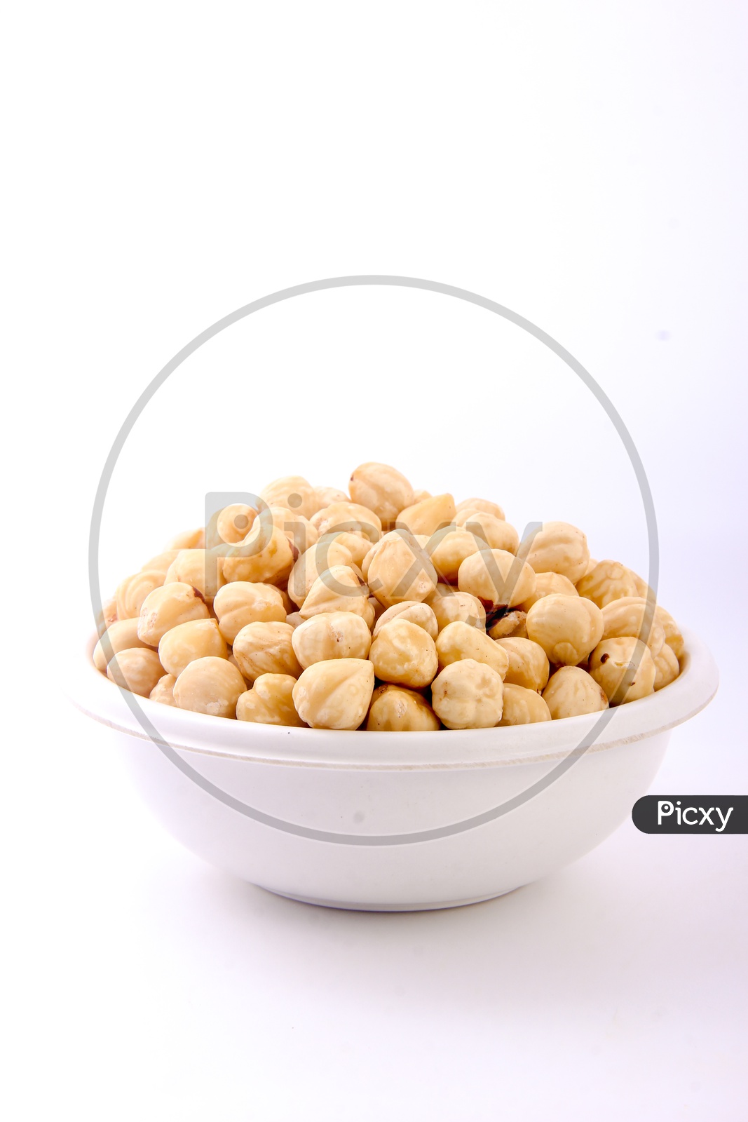 Chickpeas / Garbanzo Beans / Channa Dal / Kabuli Channa in a Bowl on an White Background