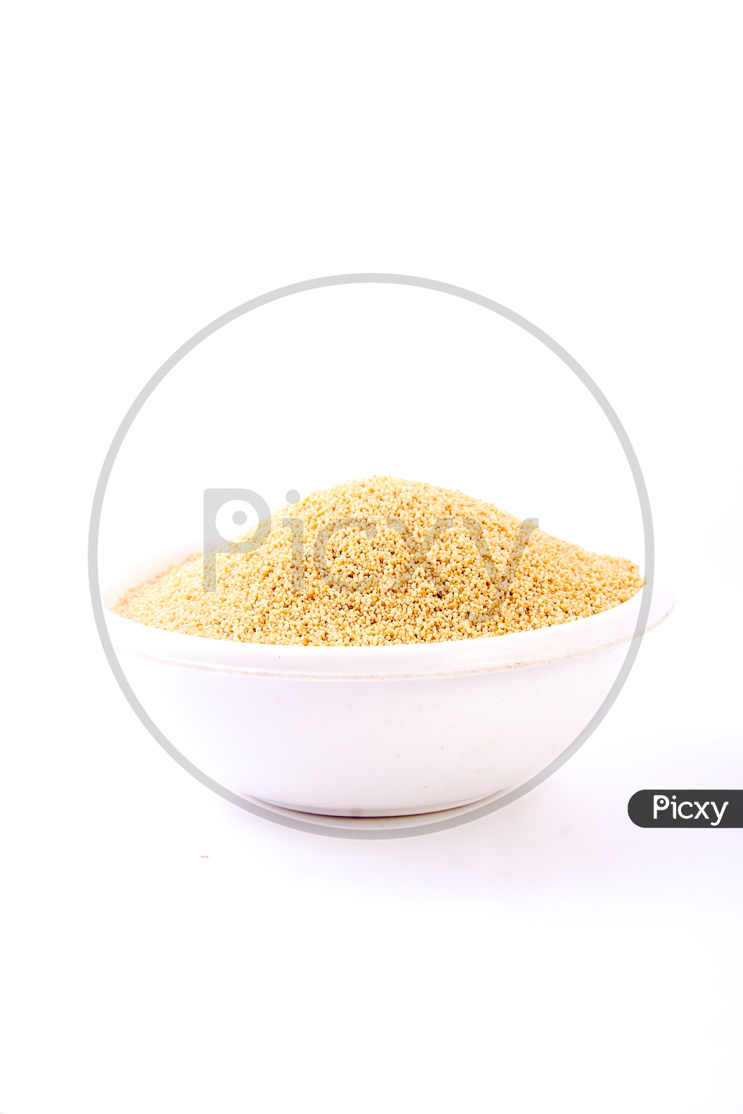 Image of Dried Millet Groats in a Bowl on an Isolated White Background