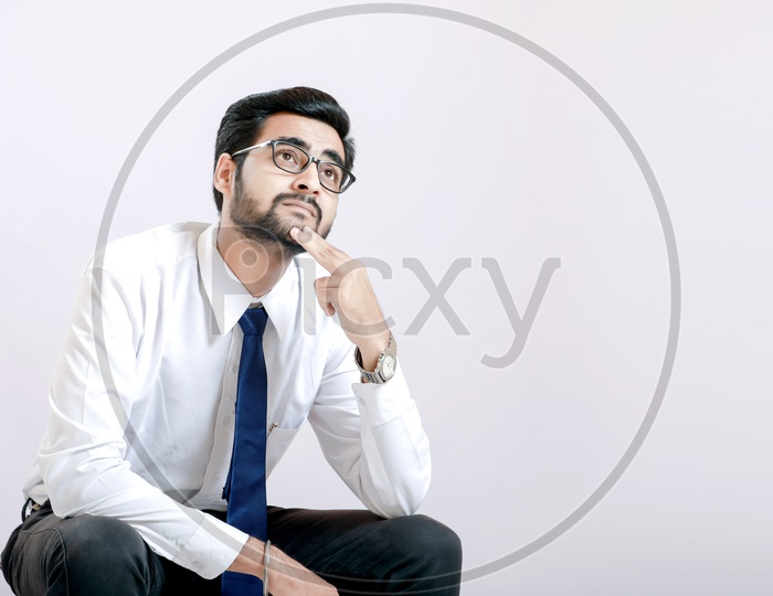 Indian Businessman on Spectacles Thinking