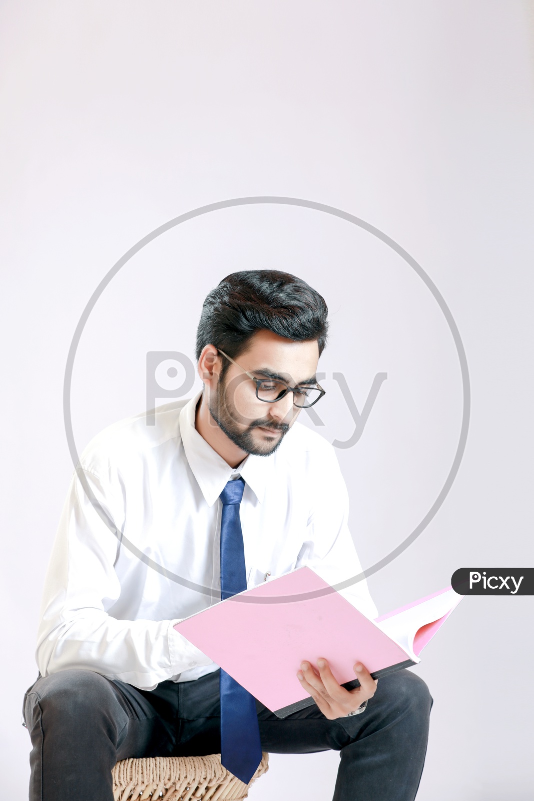 Young handsome man  referring documents with White background / Young Man Portrait